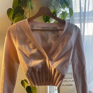 Urban Outfitters: baby pink button up cardigan